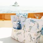Kim Hovell blue oyster shell pattern 40 ounce tumbler in a tote bag on a small picnic yacht 