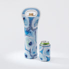 Kim Hovell wine tote with 'Ebb and Flow' blue and white oyster pattern, designed to carry a wine bottle. Featured matching can koozie beside tote.