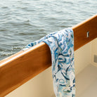 Kim Hovell blue and white patterned oyster towel hanging on Hinckley yacht