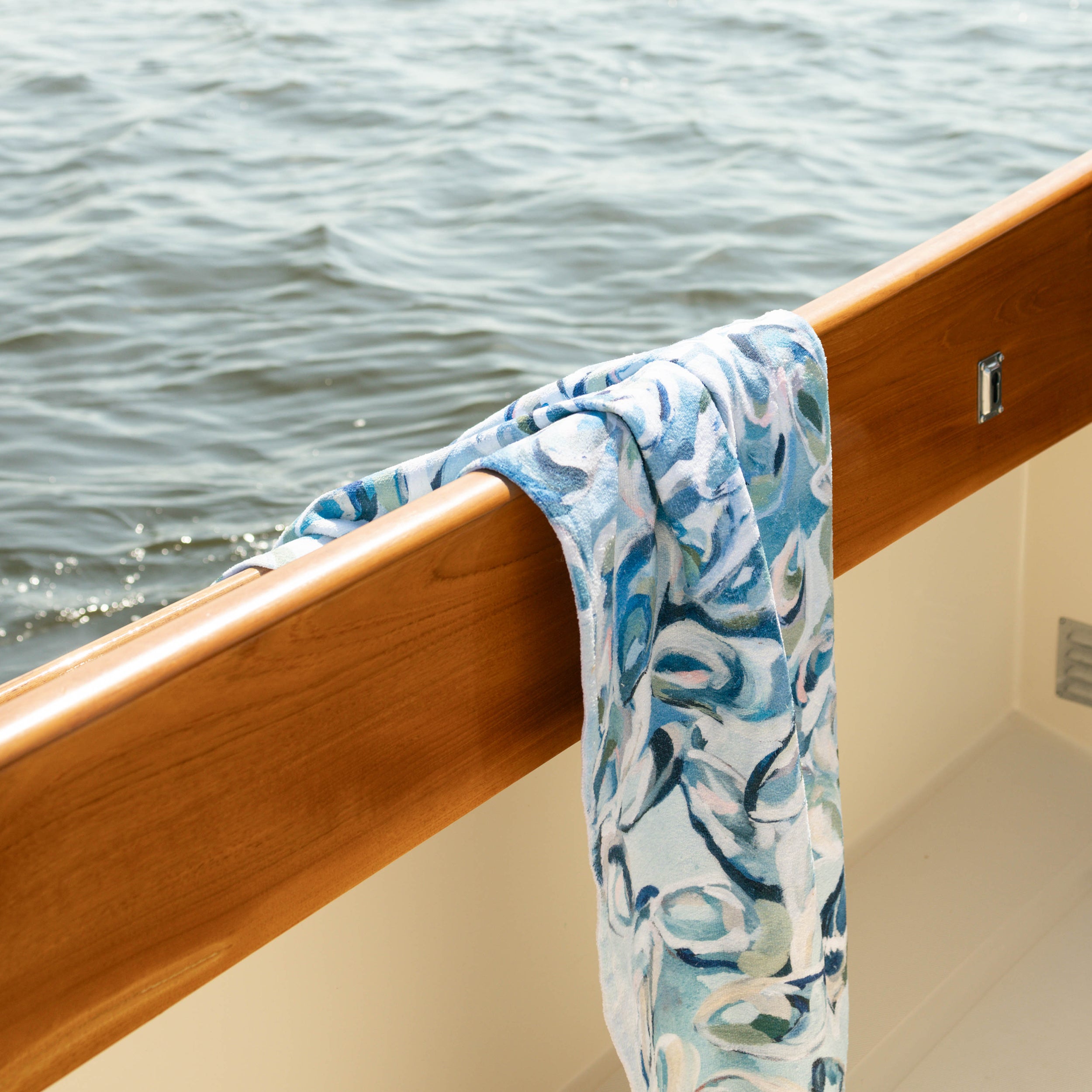 Kim Hovell blue and white patterned oyster towel hanging on Hinckley yacht