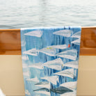 Kim Hovell oversized towel with sailboat pattern 'race day' hanging on hinckley yacht 