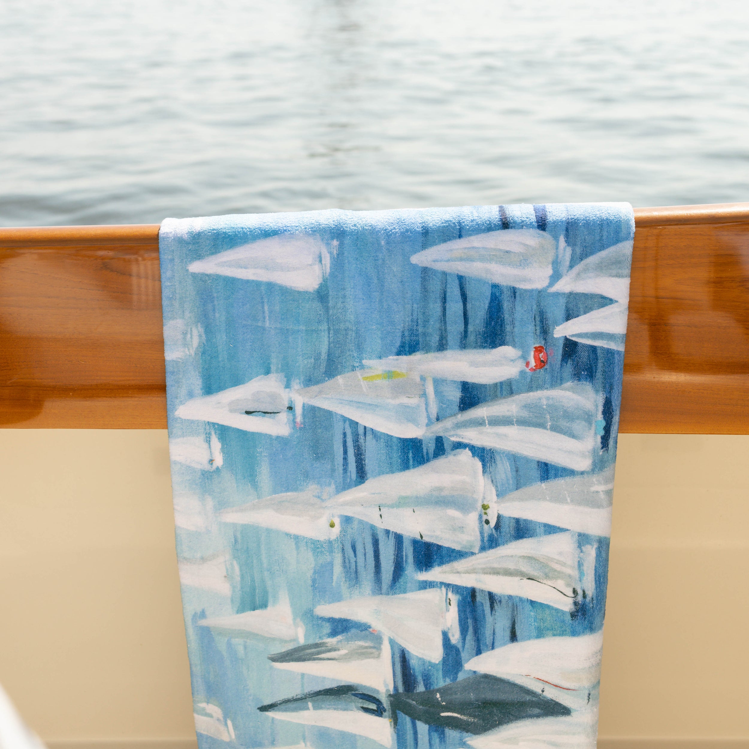 Kim Hovell oversized towel with sailboat pattern 'race day' hanging on hinckley yacht 