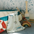 Kim Hovell Bay Blues crab pattered baby blanket featured in a Children's room with nautical decor 