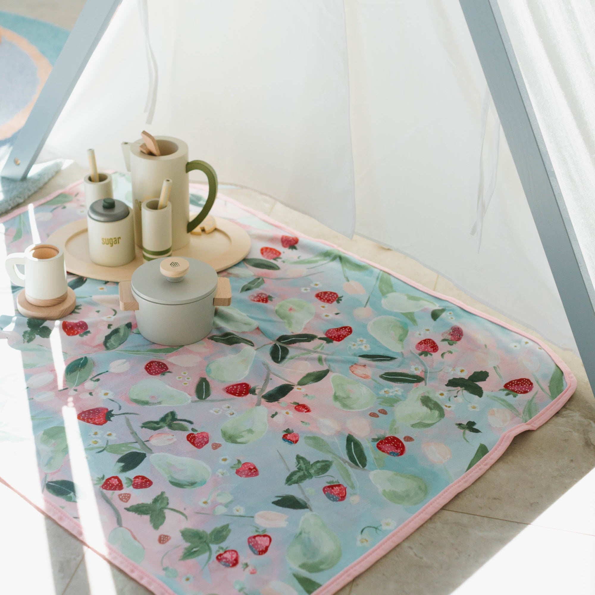 Kim Hovell Field and Vine fruit blanket in a Children's play room