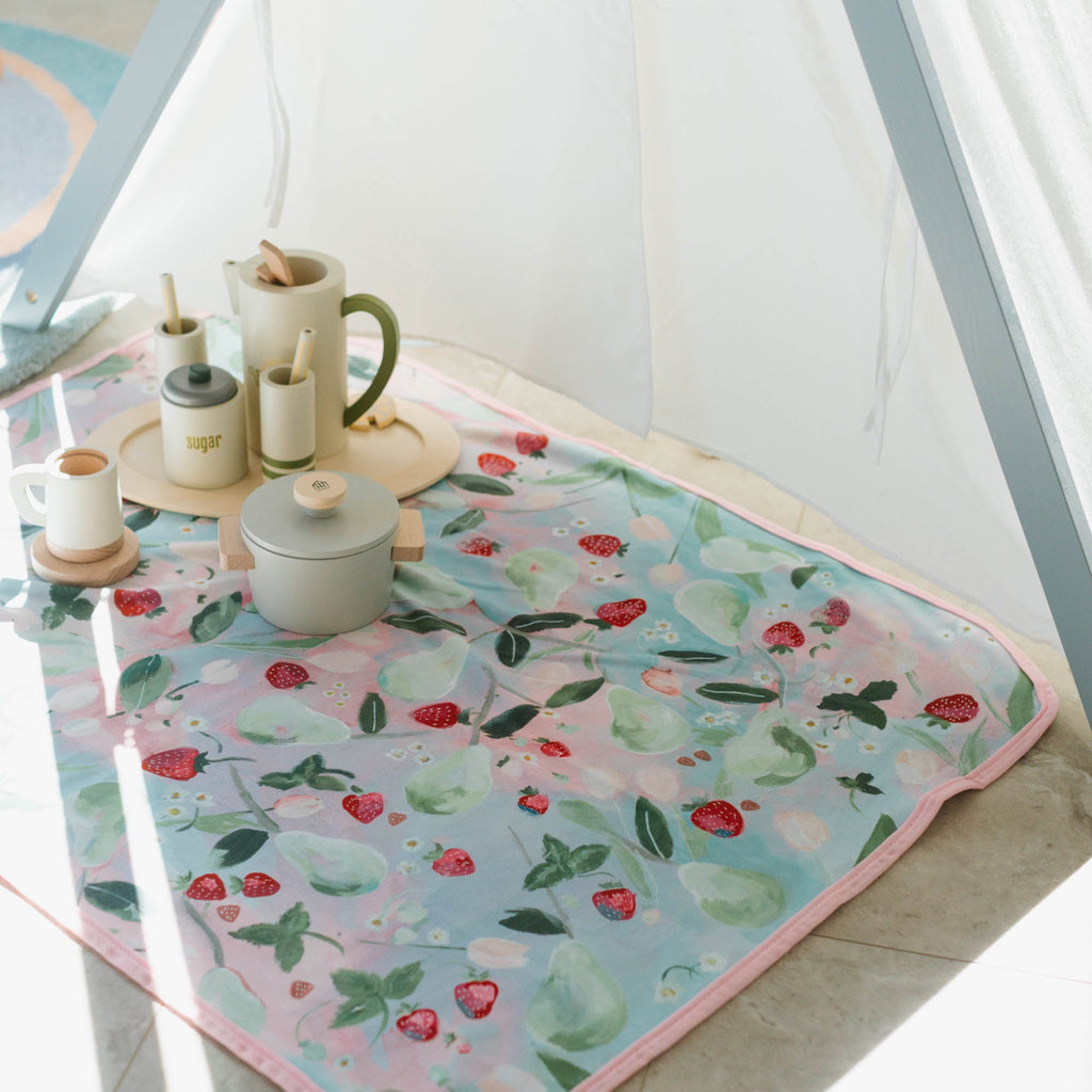 Kim Hovell Field and Vine fruit blanket in a Children's play room