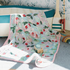 Kim Hovell Field and Vine fruit-patterned baby blanket in children's play room