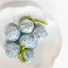 Kim Hovell decoupage ornament trio in a shell bowl