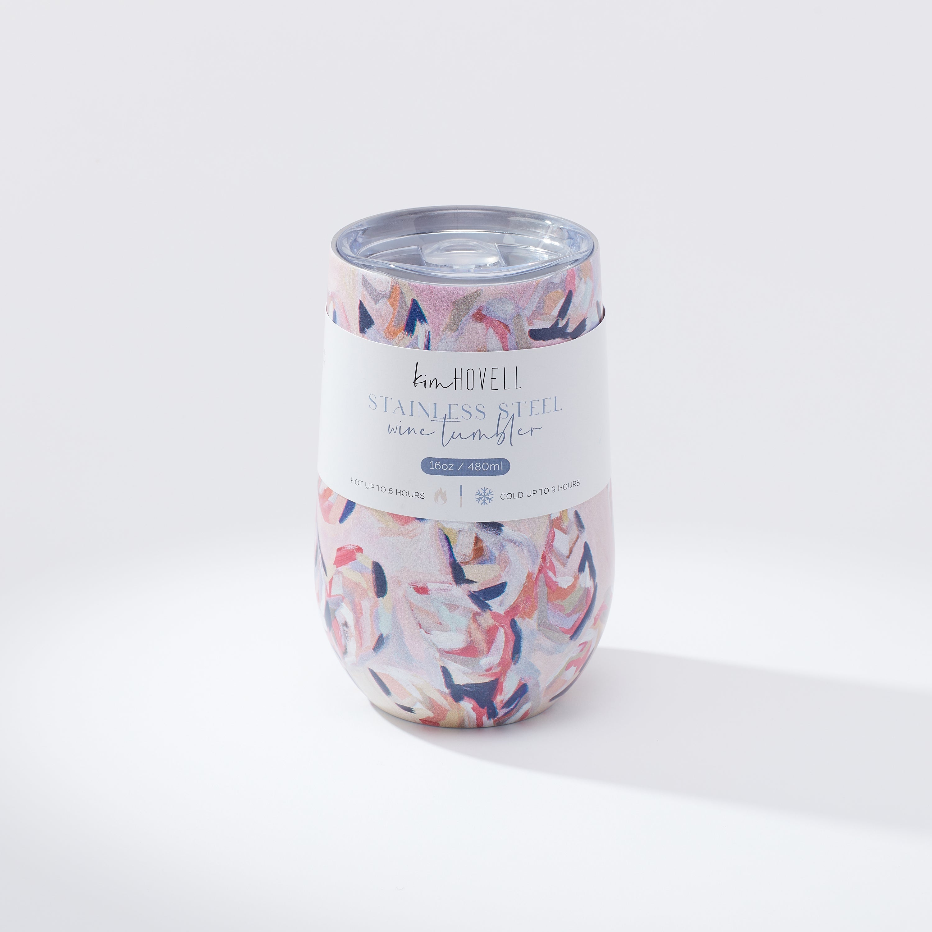 Kim Hovell Peach Gems shell-patterned tumbler with lid featuring info sleeve and white studio background 